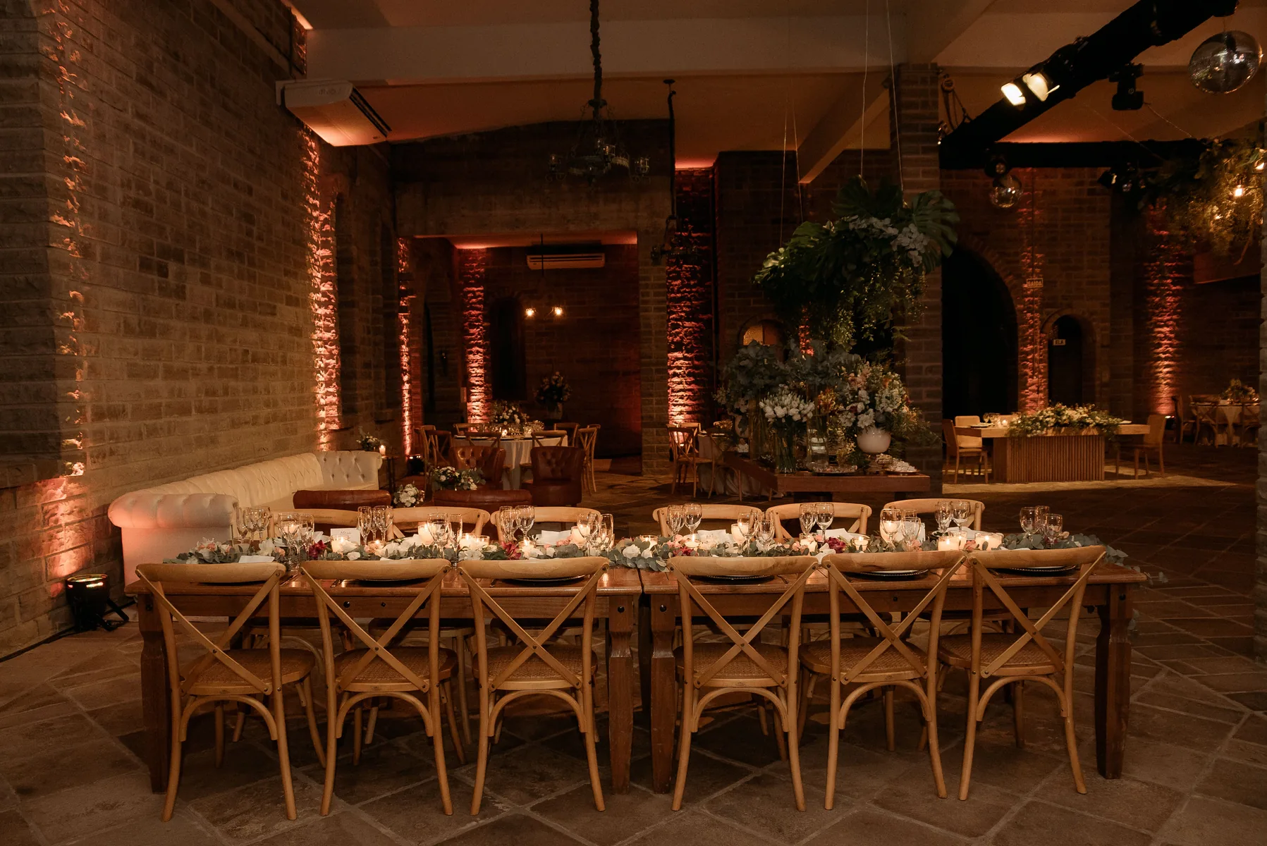 Warm ambient hall uplighting for wedding or private event